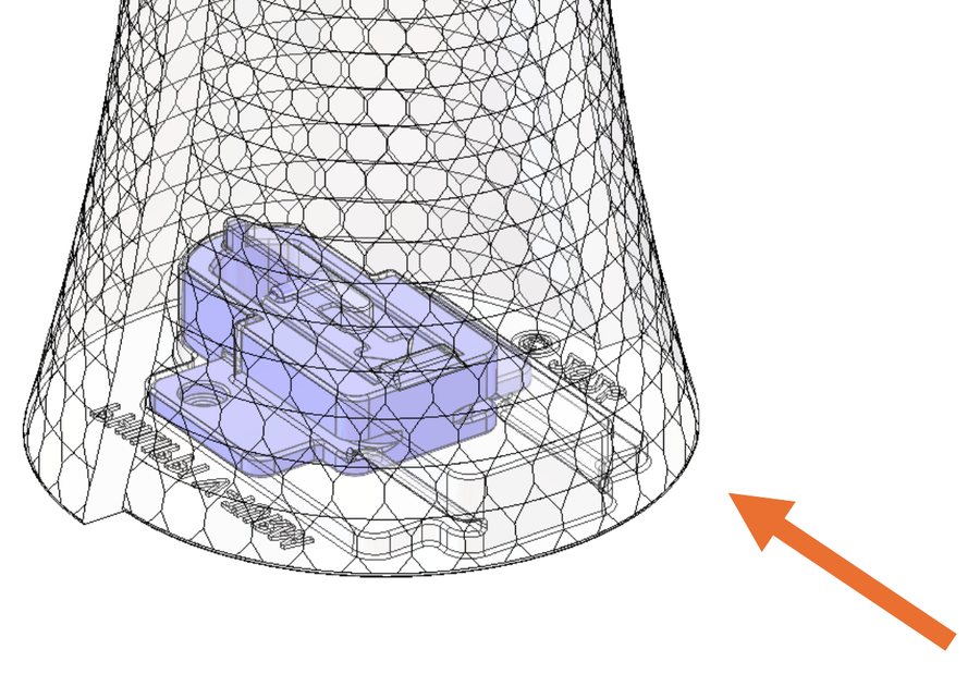 Cutaway of the V-Turm base sliding onto the mount, with an arrow showing the direction